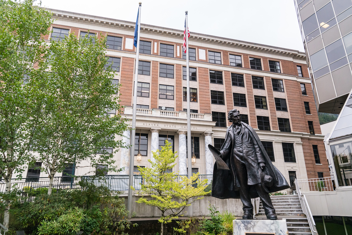 Juneau, Alaska - September 8, 2020: Statue of William Seward, responsible for the purchase of the Alaska Territory, stands in front of Alaska Capitol Building in Juneau